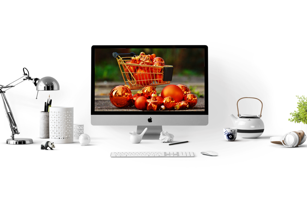 Minimalistinen työpöytä iMac-näytöllä, joka symboloi WordPress-sivuston suunnittelua.